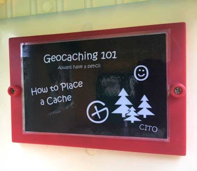 A sign that says geocaching 101 class in session made to look like a chalkboard